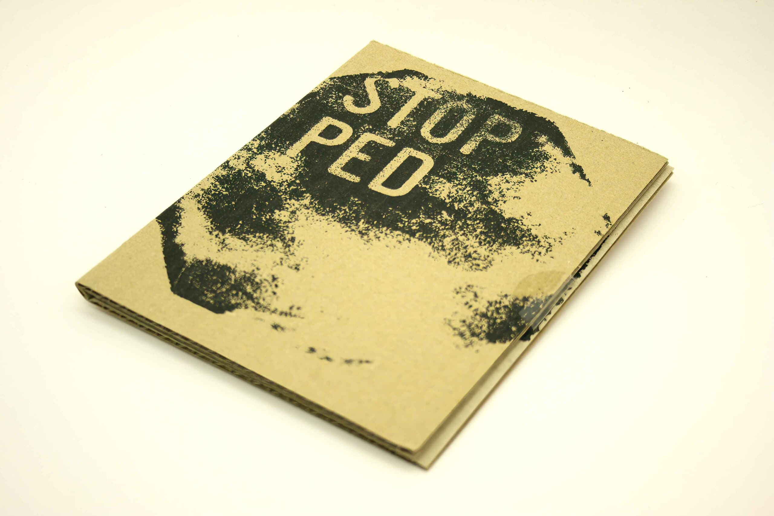Black screen print on brown corrugated cardboard